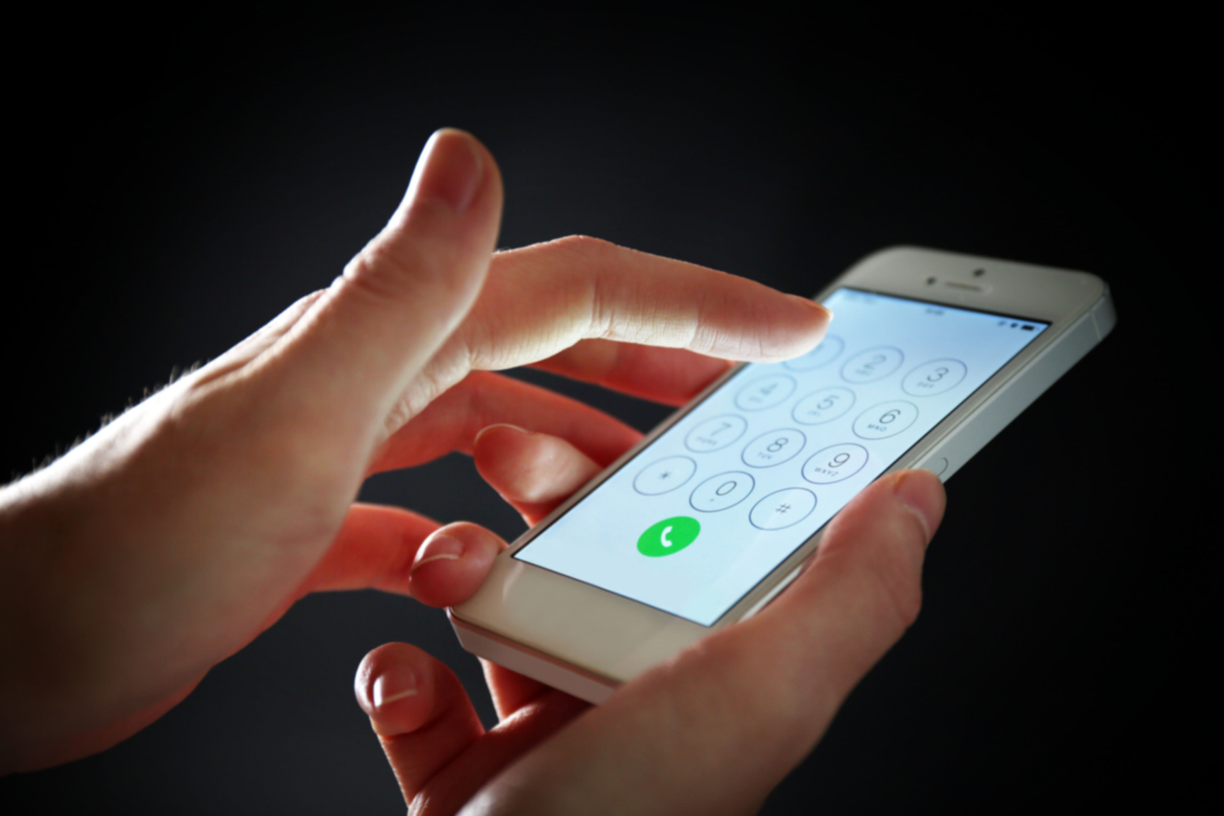Finger Dialing Number on Smartphone to Make a Call 